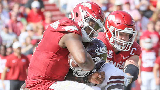 Razorbacks quarterback KJ Jefferson hit by Mississippi State's Nathan Pickering